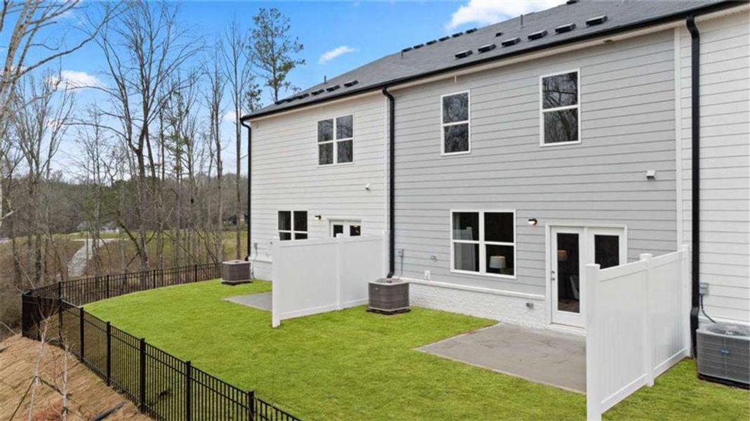 Exterior details and patio area of a home in Echo Glen, Stockbridge (Image 30).