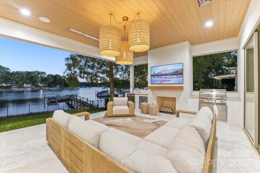 Covered outdoor living features a gas fireplace, Bull appliances and quartzite countertops. Covered outdoor living features a gas fireplace, Bull appliances and quartzite countertops.