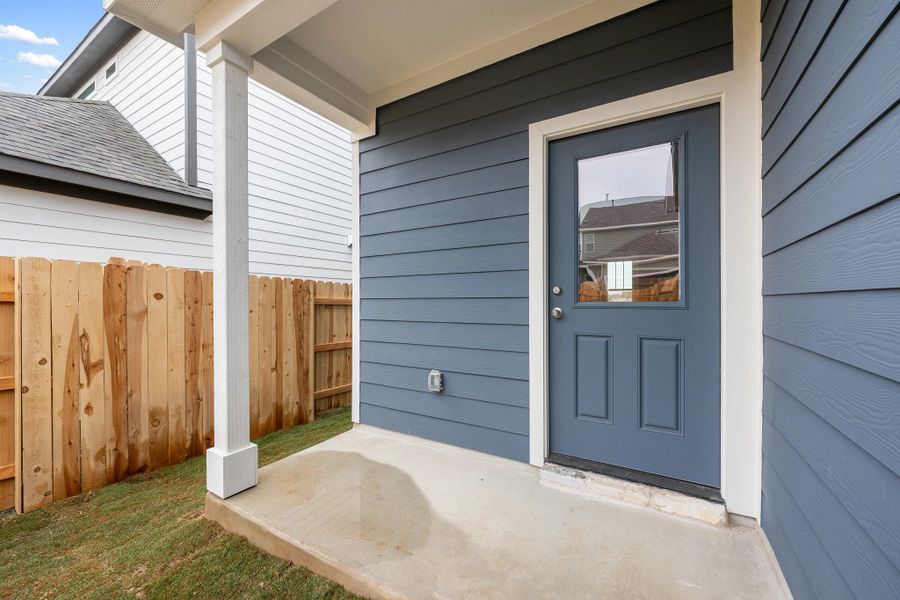 Exterior details and patio area of a home in The Cottages at Lariat, Liberty Hill (Image 28).
