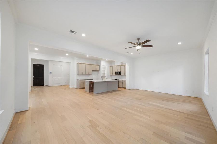 Wood flooring throughout the first floor and stairs are part of Sandcastle Homes' standard features.  (Sample photos of a completed Lisbon floor plan. The image may feature alternative selections and/or upgrades.)