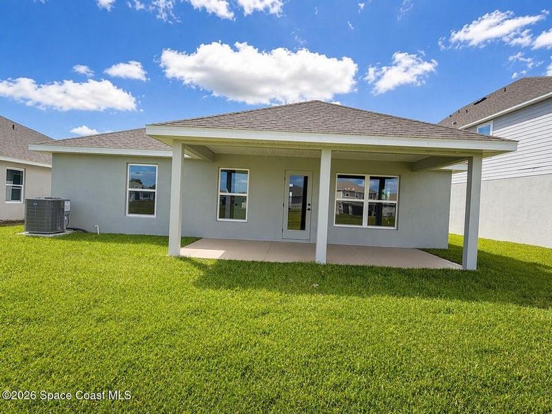 Exterior details and patio area of a home in St. John's Preserve, Palm Bay (Image 3).