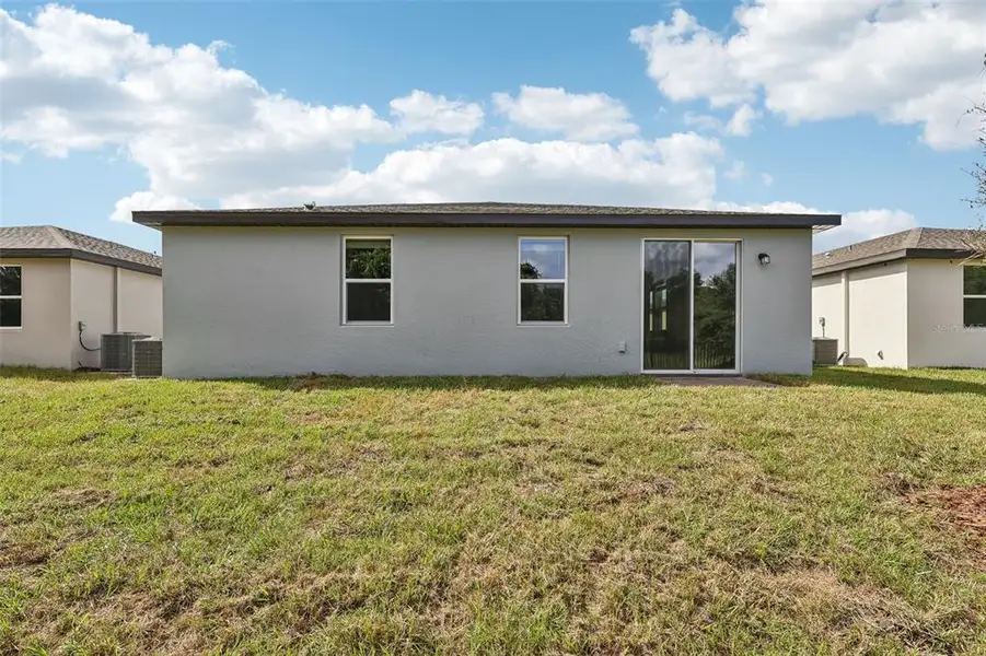 Exterior details and patio area of a home in Bradbury Creek - Signature Series, Haines City (Image 3).
