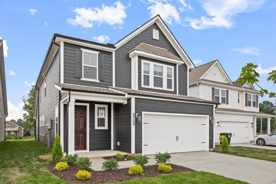 Front exterior of a new home in Sweetgrass Station, Summerville, SC, highlighting curb appeal (Image 17).