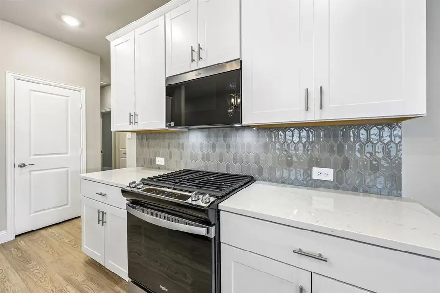 Furnished interior view inside a new home in Parks at Foster Crossing - Spring Series, Anna (Image 11).