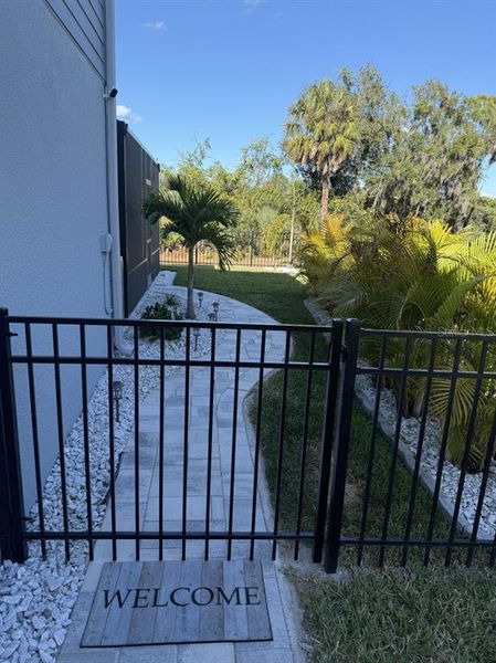 Exterior details and patio area of a home in Isles at BayView, Parrish (Image 26).