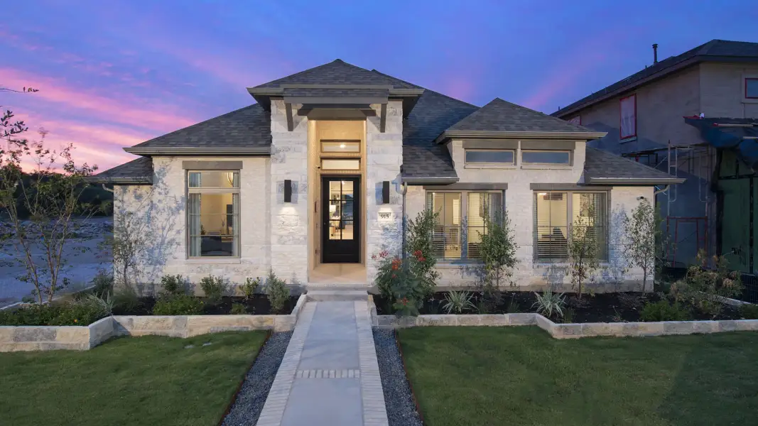 Front exterior of a new home in Canyon Falls, Northlake, TX, highlighting curb appeal (Image 2).