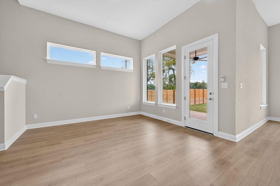 Entryway with wood finished floors and baseboards