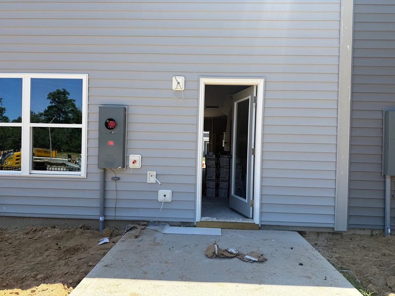 Exterior details and patio area of a home in Towns at The Point, Rolesville (Image 3).