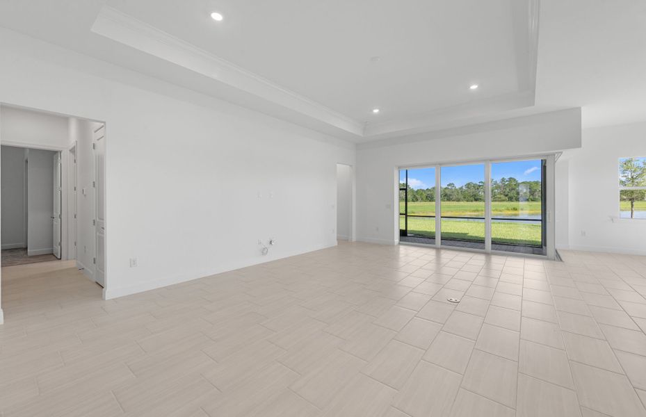 Spacious gathering room featuring a drop tray ceiling