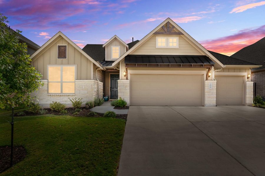Craftsman-style house featuring a standing seam roof, a metal roof, stone siding, driveway, and board and batten siding Craftsman-style house featuring a standing seam roof, a metal roof, stone siding, driveway, and board and batten siding