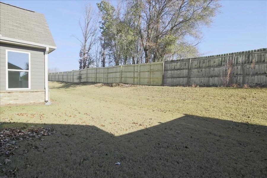 Exterior details and patio area of a home in Cooper's Walk, Loganville (Image 19).