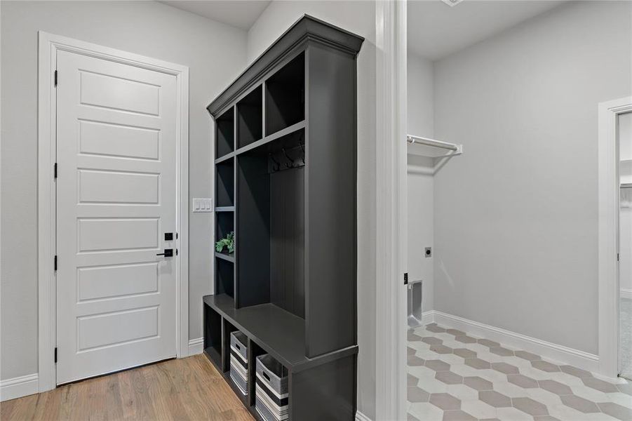 Mudroom with hardwood / wood-style floors