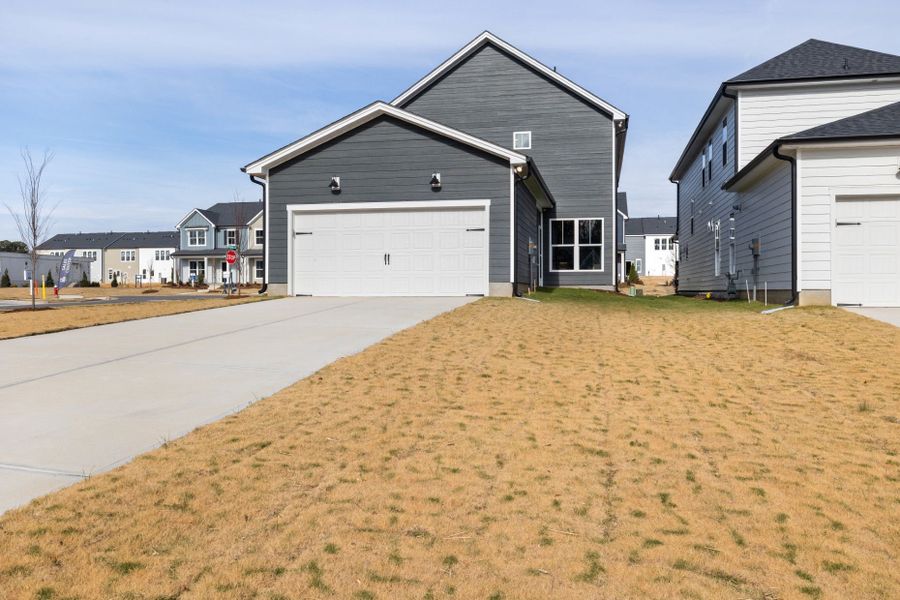 Representative exterior photo of a completed home built from the Rockingham by Pulte Homes in Saunders Farm, Fuquay Varina, NC (Image 26).