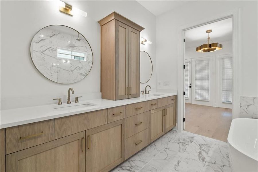 Luxurious bath with saoking tub and walk-in shower.