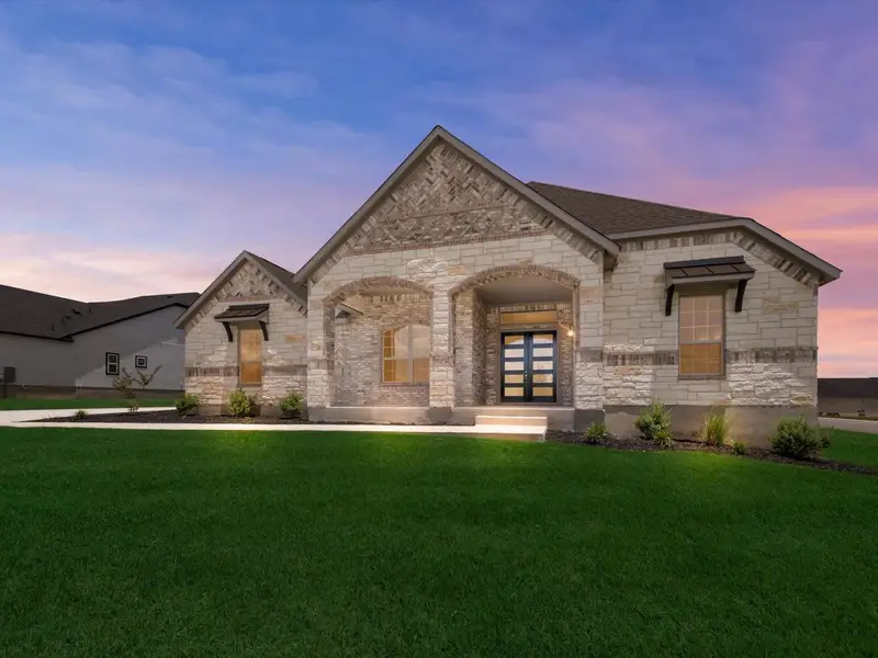 Front exterior of a new home in Potranco Oaks, Castroville, TX, highlighting curb appeal (Image 2).
