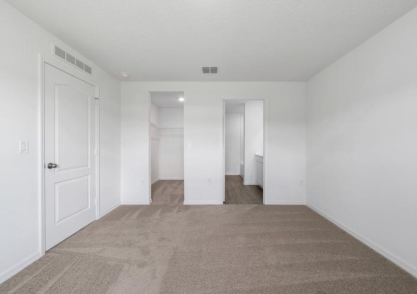 The master bedroom has its own walk-in closet and bathroom.