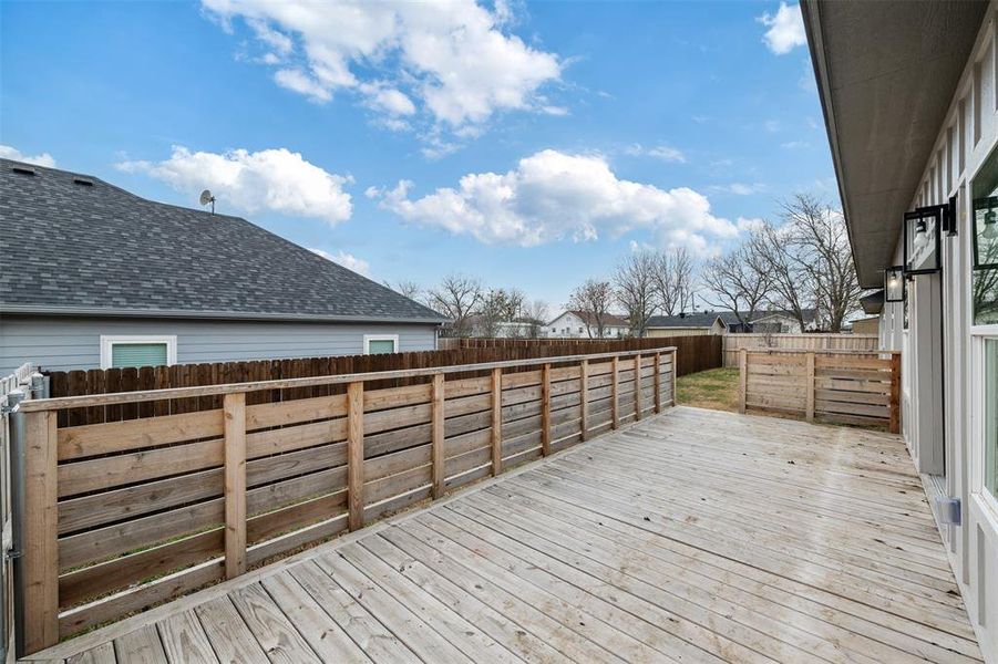 Deck with a fenced backyard