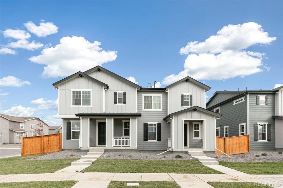 Front exterior of a new home in Sky Ranch Villas, Watkins, CO, highlighting curb appeal (Image 2).