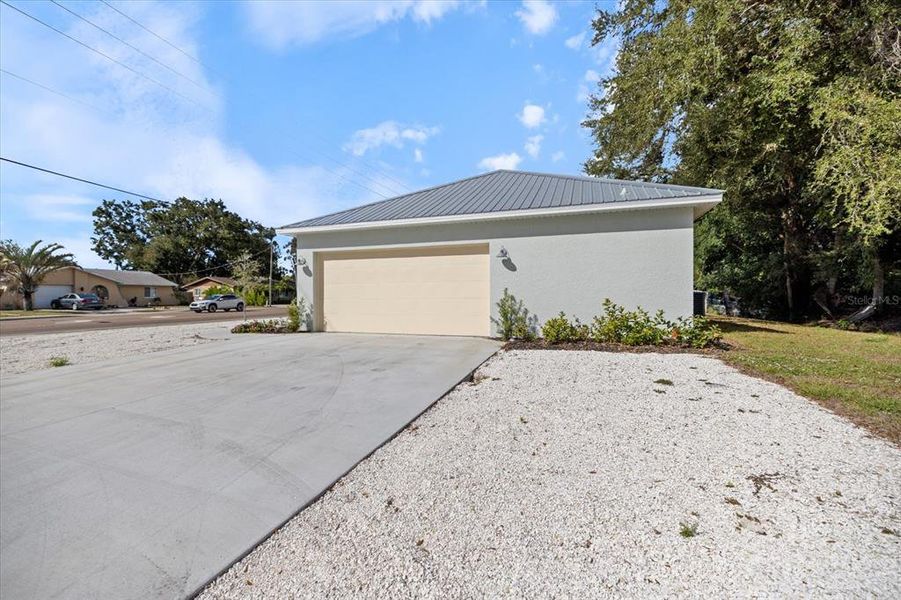 Front exterior of a new home in , Sarasota, FL, highlighting curb appeal (Image 29).