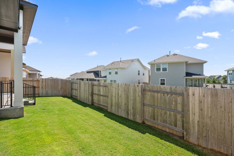 Exterior details and patio area of a home in Lariat, Liberty Hill (Image 28).