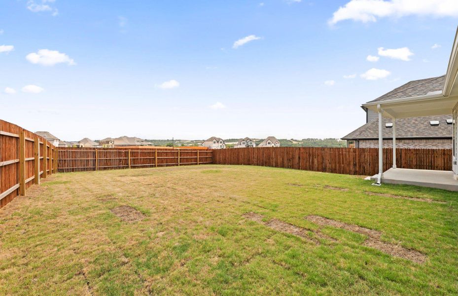 Exterior details and patio area of a home in Saddleback at Santa Rita Ranch, Liberty Hill (Image 20).