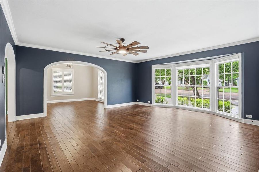 Showing large open concept living area with wood floors, leading into kitchen and dining room. Picture perfect space to call home. Showing large open concept living area with wood floors, leading into kitchen and dining room. Picture perfect space to call home.