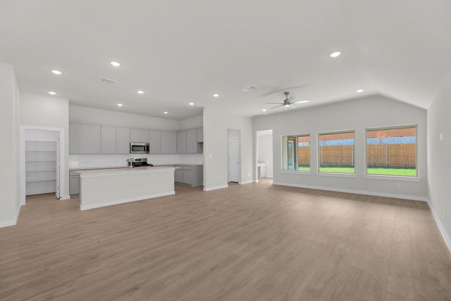 Living Room and Kitchen in the Evelyn Pecos model home in Austin TX by Trophy Signature Homes