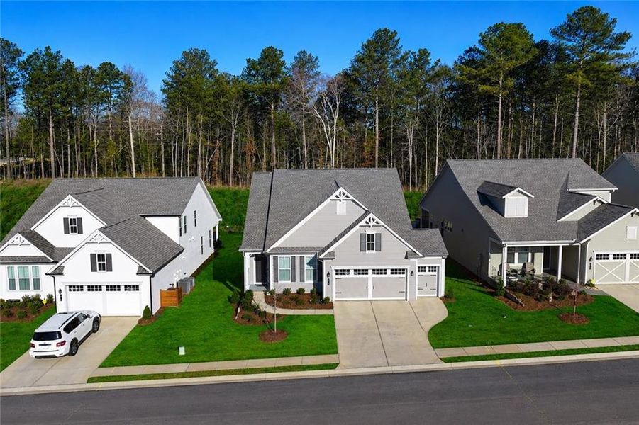 Front exterior of a new home in , Hoschton, GA, highlighting curb appeal (Image 26).