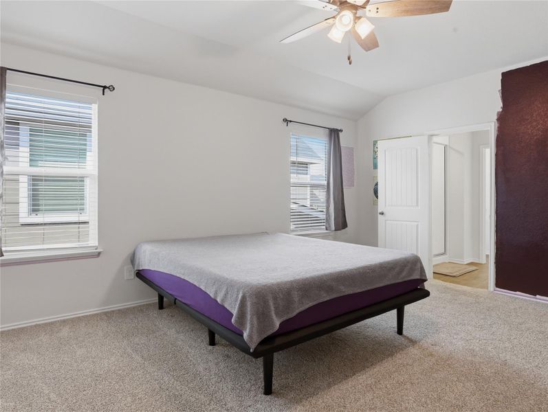 Plush carpeting and vaulted ceilings enhance this serene main floor bedroom suite. Plush carpeting and vaulted ceilings enhance this serene main floor bedroom suite.