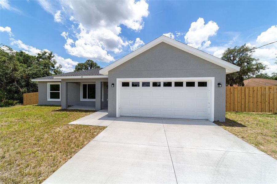 Front exterior of a new home in , Ocklawaha, FL, highlighting curb appeal (Image 23).