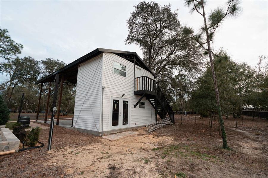 Exterior details and patio area of a home in , Bronson (Image 3).