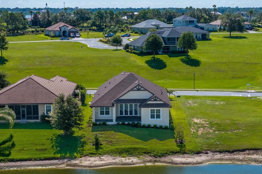 Front exterior of a new home in , Auburndale, FL, highlighting curb appeal (Image 1).