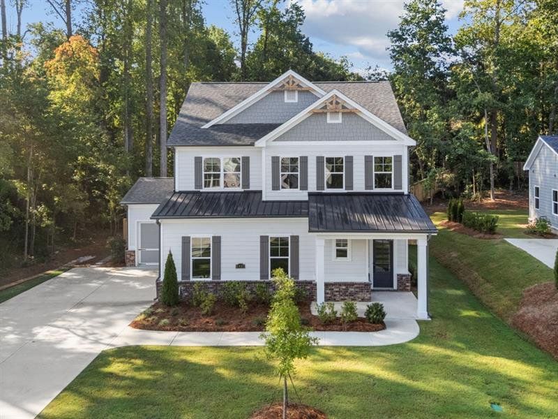 Front exterior of a new home in Arden on Lanier, Cumming, GA, highlighting curb appeal (Image 16).