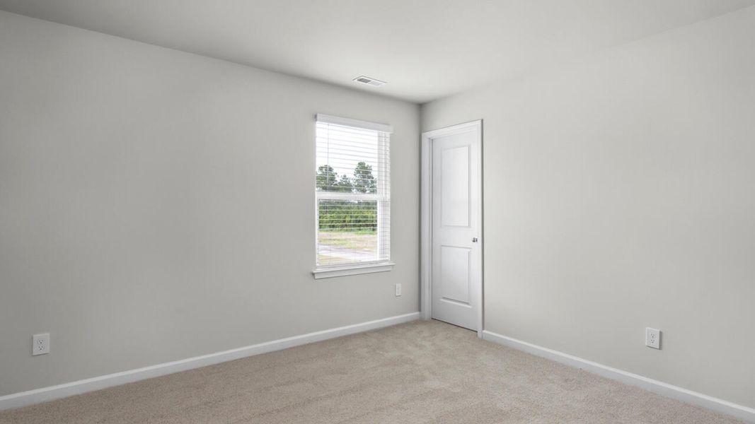 Spacious, unfurnished interior of a new home in Surfside Landing, Hubert (Image 31).