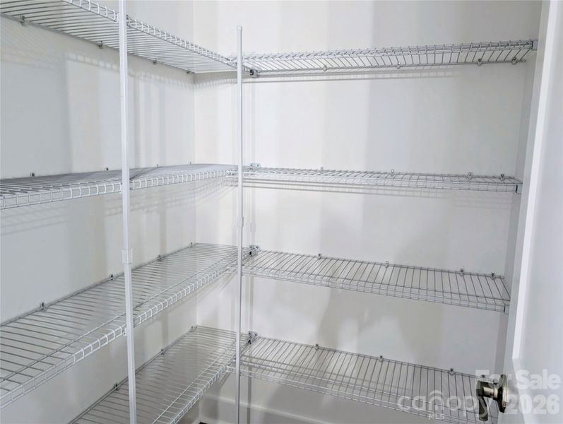 Pantry with 4 levels of shelving. Pantry with 4 levels of shelving.