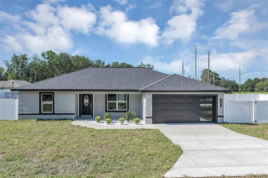 Front exterior of a new home in , Dunnellon, FL, highlighting curb appeal (Image 17). Front exterior of a new home in , Dunnellon, FL, highlighting curb appeal (Image 17).