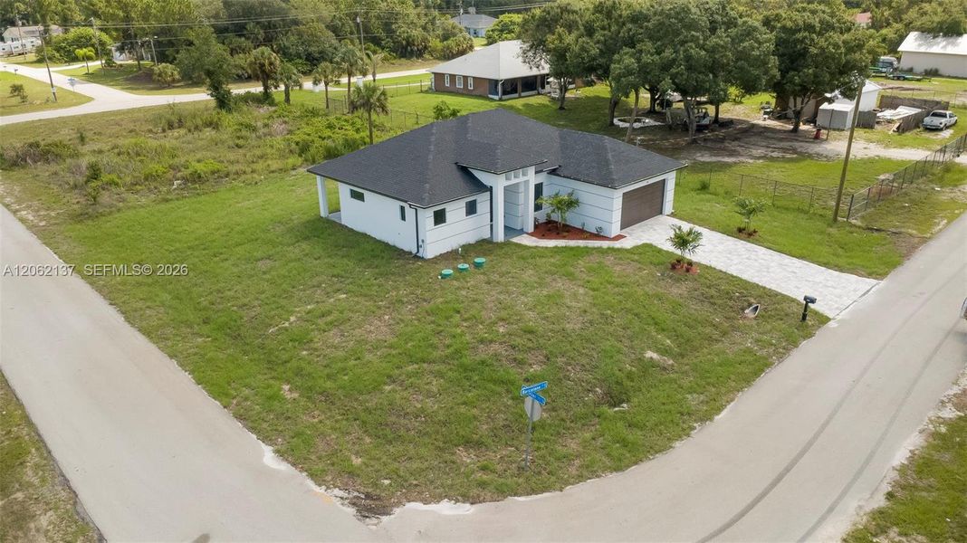 Front exterior of a new home in , Lehigh Acres, FL, highlighting curb appeal (Image 16).