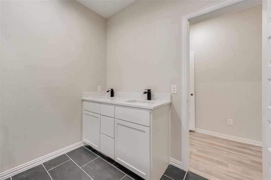 Bathroom featuring vanity and hardwood / wood-style flooring