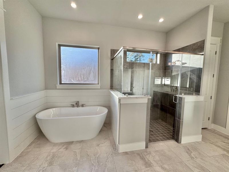 Luxurious and Large Soaker Tub with Walk-In Shower in Primary Bath