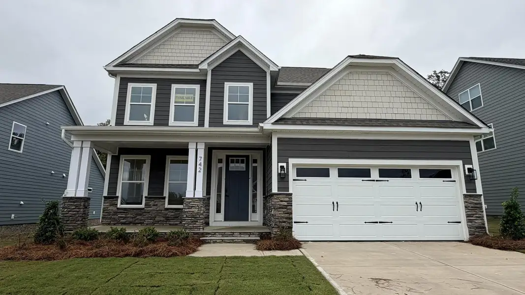 Front exterior of a new home in Waterford Commons, Rock Hill, SC, highlighting curb appeal (Image 1). Front exterior of a new home in Waterford Commons, Rock Hill, SC, highlighting curb appeal (Image 1).