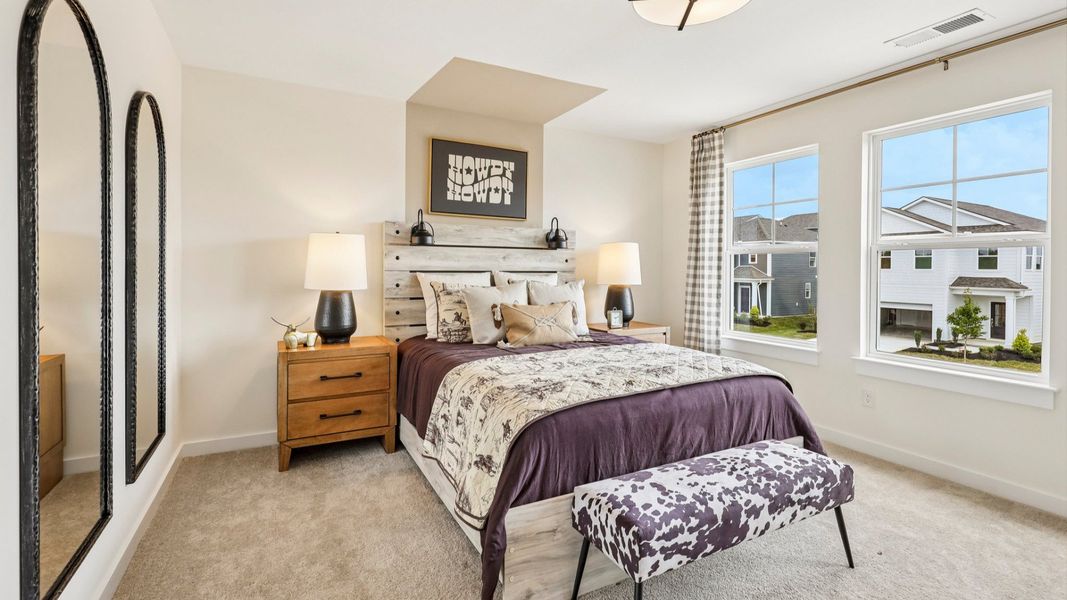 Secondary bedroom with carpet, closet, and window Secondary bedroom with carpet, closet, and window