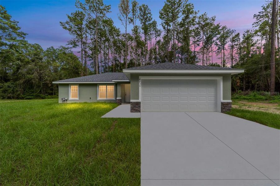 Front exterior of a new home in , Dunnellon, FL, highlighting curb appeal (Image 1).