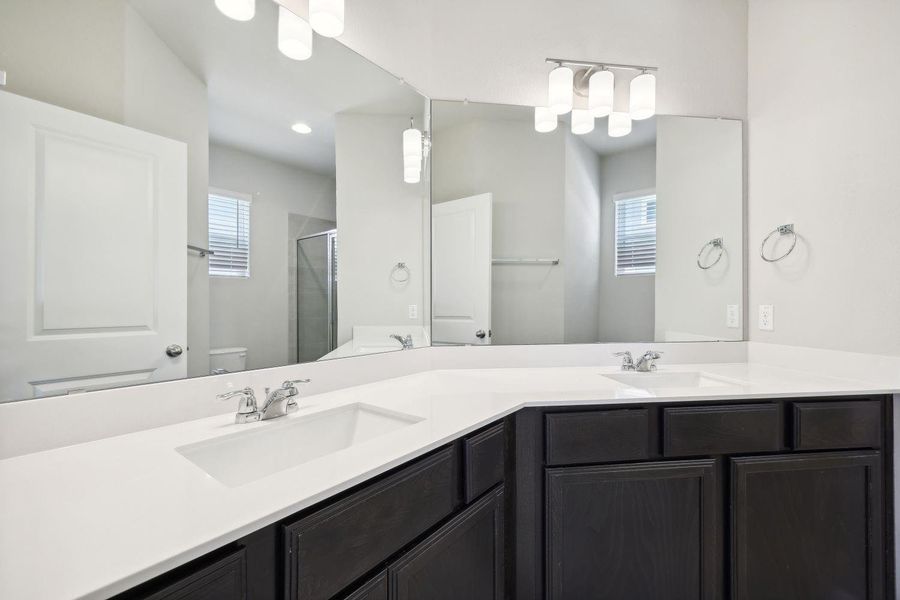 Primary bathroom w/ dual vanities