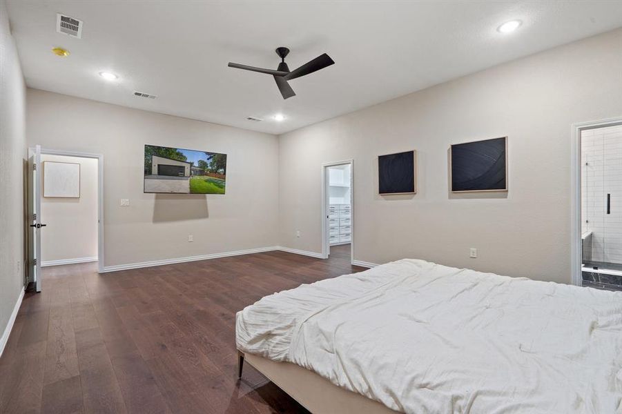 Bedroom featuring dark wood-style floors, ceiling fan, and recessed lighting Bedroom featuring dark wood-style floors, ceiling fan, and recessed lighting