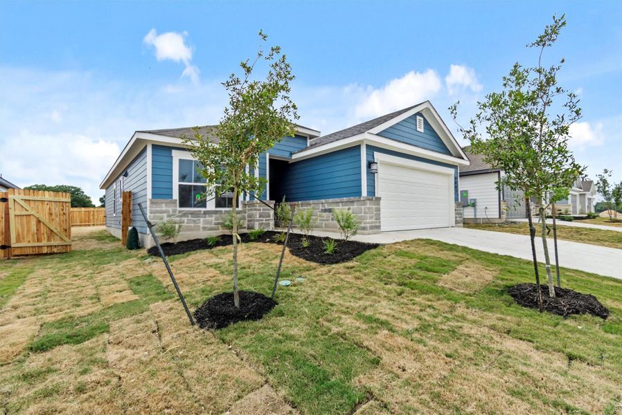 Front exterior of a new home in Butler Farms, Liberty Hill, TX, highlighting curb appeal (Image 1). Front exterior of a new home in Butler Farms, Liberty Hill, TX, highlighting curb appeal (Image 1).
