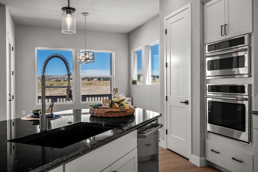 Furnished interior view inside a new home in Revel Crossing at Wolf Ranch - The Panorama Collection, Colorado Springs (Image 8). Furnished interior view inside a new home in Revel Crossing at Wolf Ranch - The Panorama Collection, Colorado Springs (Image 8).