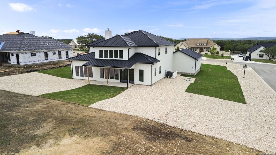 Front exterior of a new home in , Bulverde, TX, highlighting curb appeal (Image 31).