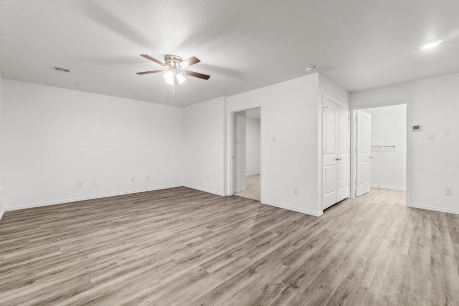 This photo shows the laundry area located next to the full bathroom, complete with washer and dryer connections. This photo shows the laundry area located next to the full bathroom, complete with washer and dryer connections.