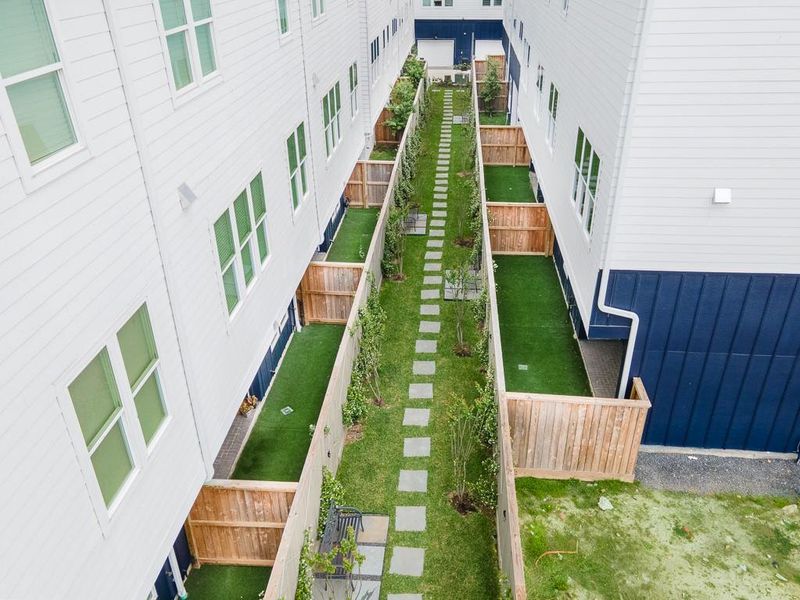 Courtyard area behind your private fenced in back yard.  Walk the dog or sit on a bench and relax.