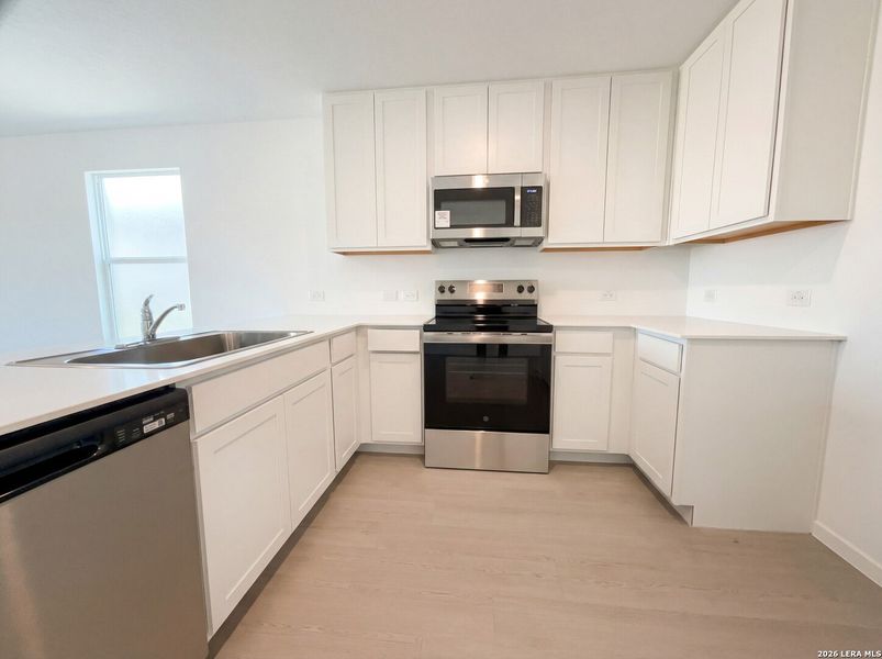 Furnished interior view inside a new home in Waters Edge, Seguin (Image 6).